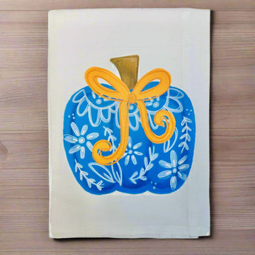 Decorative card with a blue pumpkin and yellow bow on a white background