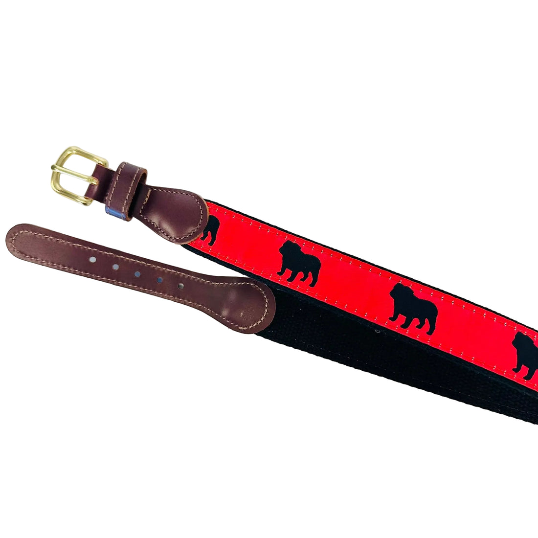 A leather and canvas belt with a bright red canvas section featuring black dog silhouettes, dark brown leather ends, and a gold buckle, laid out on a white surface.