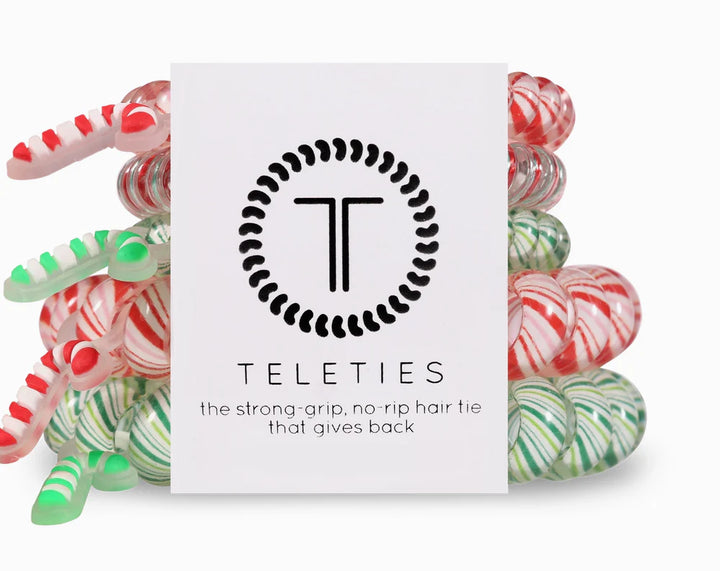 Colorful hair ties with a Teleties branded card on a white background